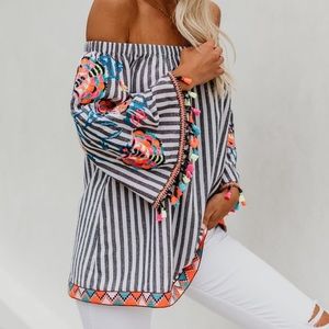 Colorful embroidered top with tassels